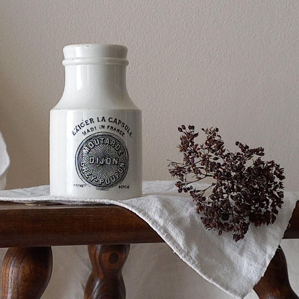 A small antique white ironstone Dijon Grey-Poupon mustard pot made by premier French manufacturer Sarreguemines. These little pots are very collectible and make wonderful pieces of home decor.