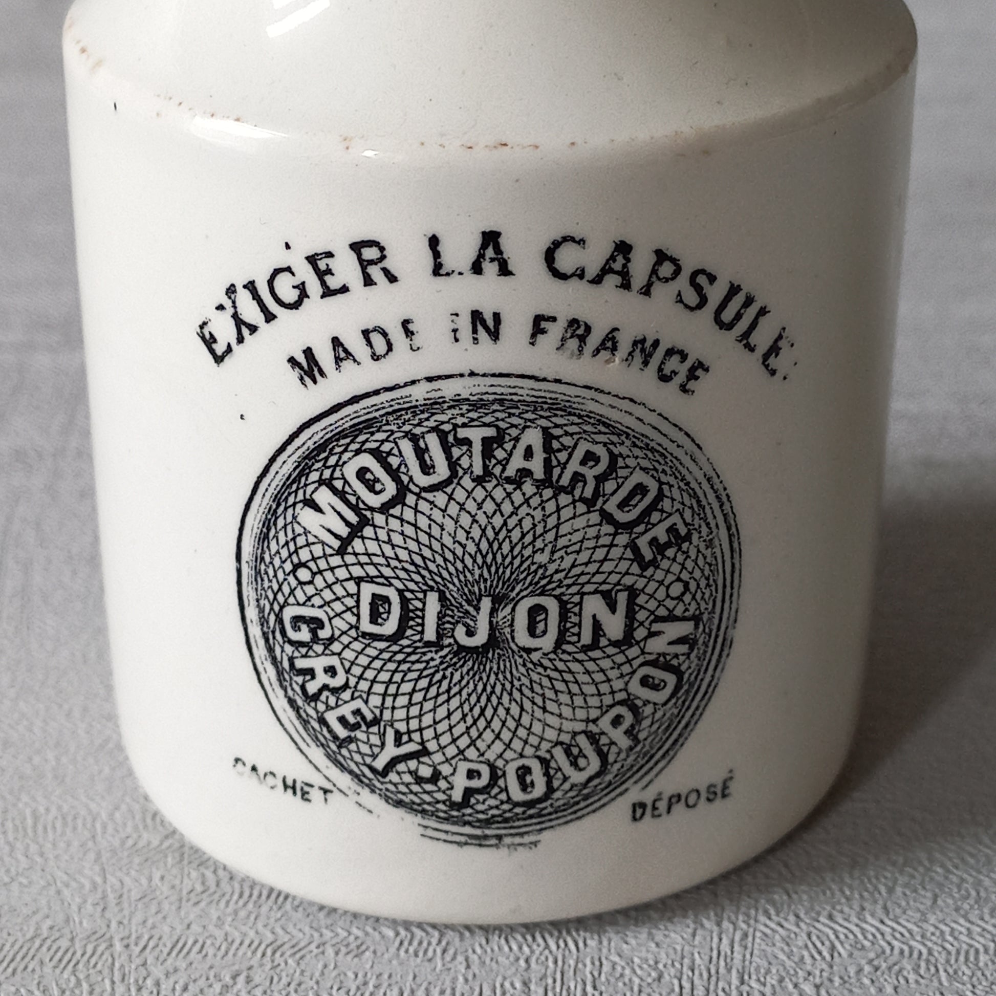 A beautiful French antique white ironstone mustard pot. This wonderful old jar was made by premier French manufacturer Sarreguemines and the maker's mark dates this particular pot as circa. late 1800s to early 1900s