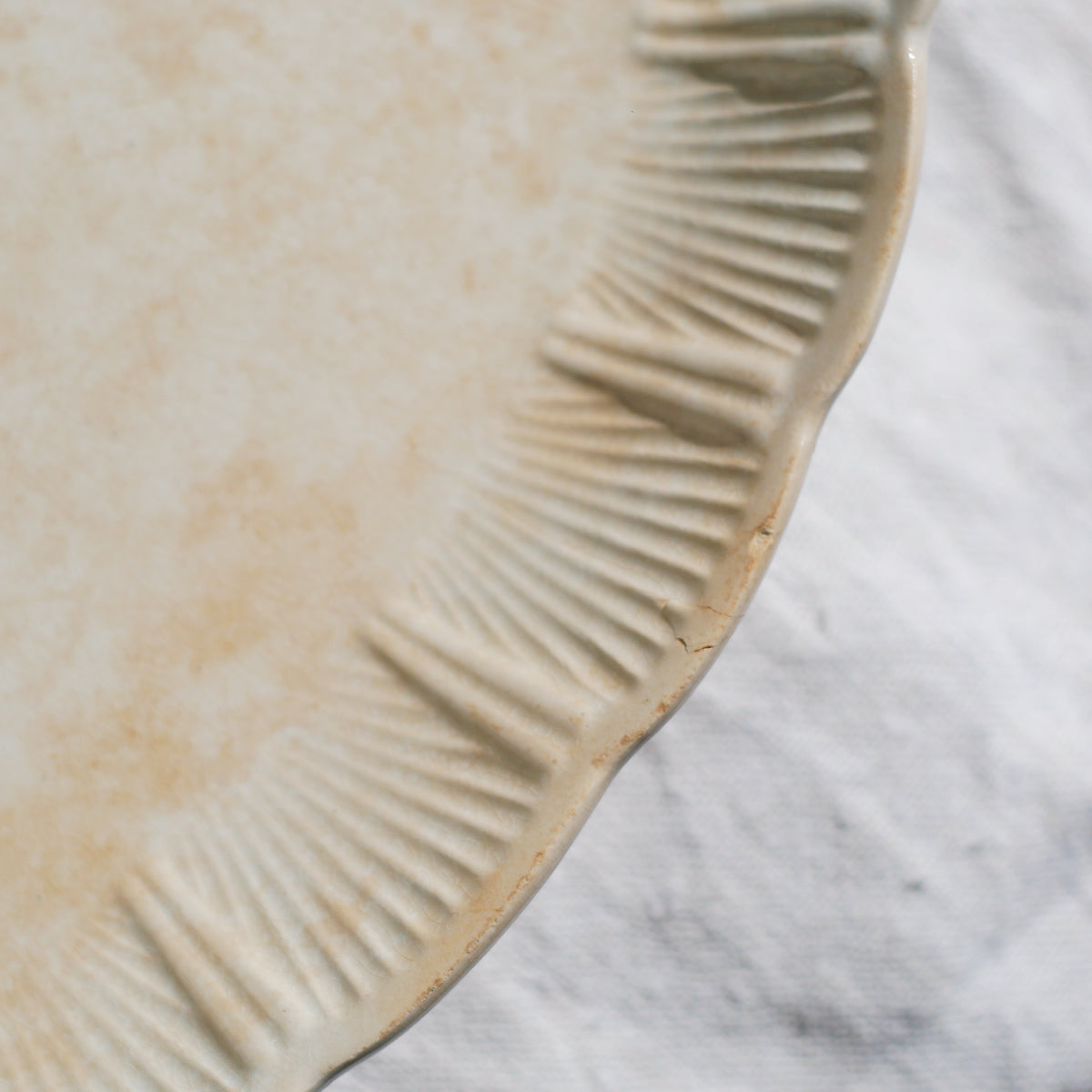 A beautiful pair of French antique ironstone raviers or side plates which over the last century or more have developed a wonderful time-worn and tea-stained finish which make them perfect for shabby chic interior decor. We very rarely come across these little plates lately they're a rare find.