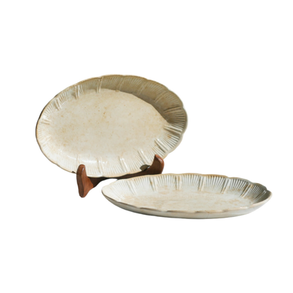 A beautiful pair of French antique ironstone raviers or side plates which over the last century or more have developed a wonderful time-worn and tea-stained finish which make them perfect for shabby chic interior decor. We very rarely come across these little plates lately they're a rare find.