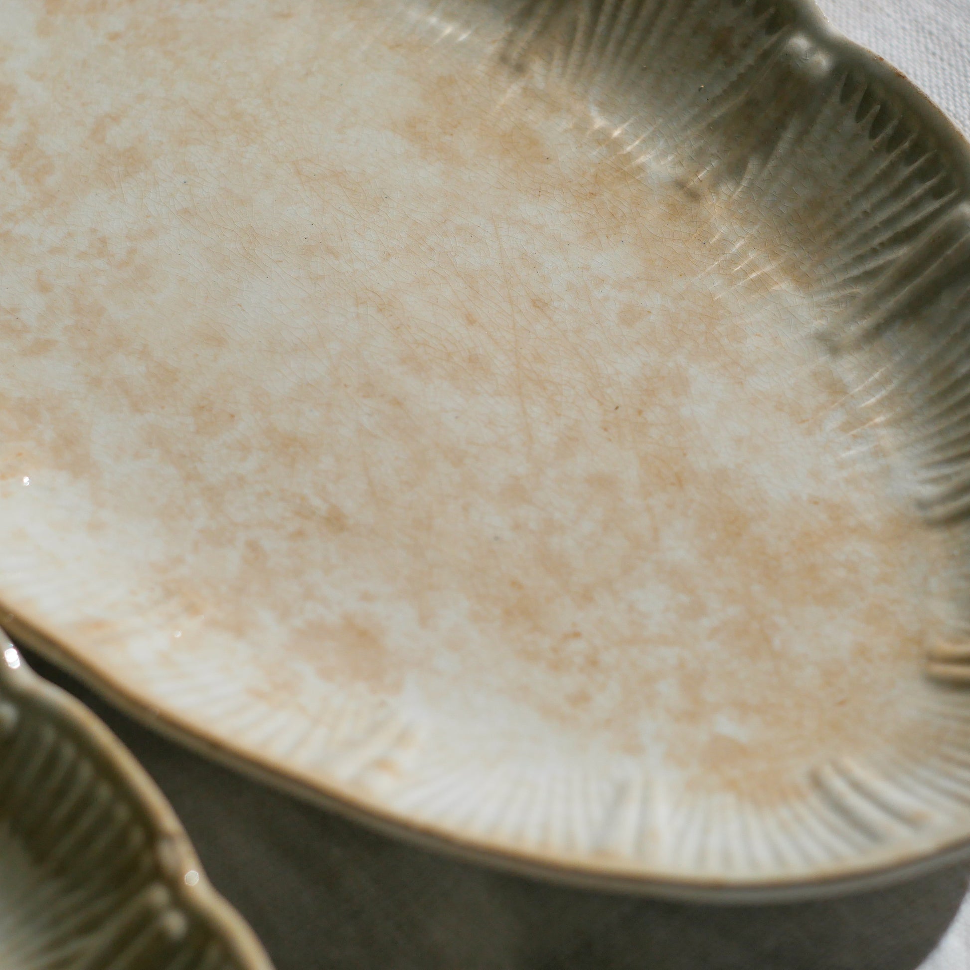 A beautiful pair of French antique ironstone raviers or side plates which over the last century or more have developed a wonderful time-worn and tea-stained finish which make them perfect for shabby chic interior decor. We very rarely come across these little plates lately they're a rare find.