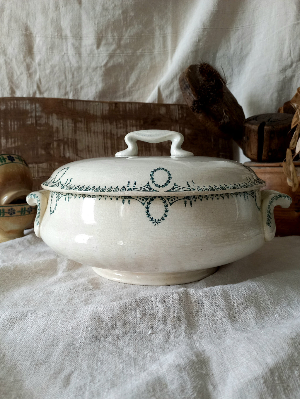 A large French antique white ironstone soup tureen with an attractive teal colour transferware design. Over the many decades this lovely old tureen has developed a time-worn patina with a warm, creamy white finish.
