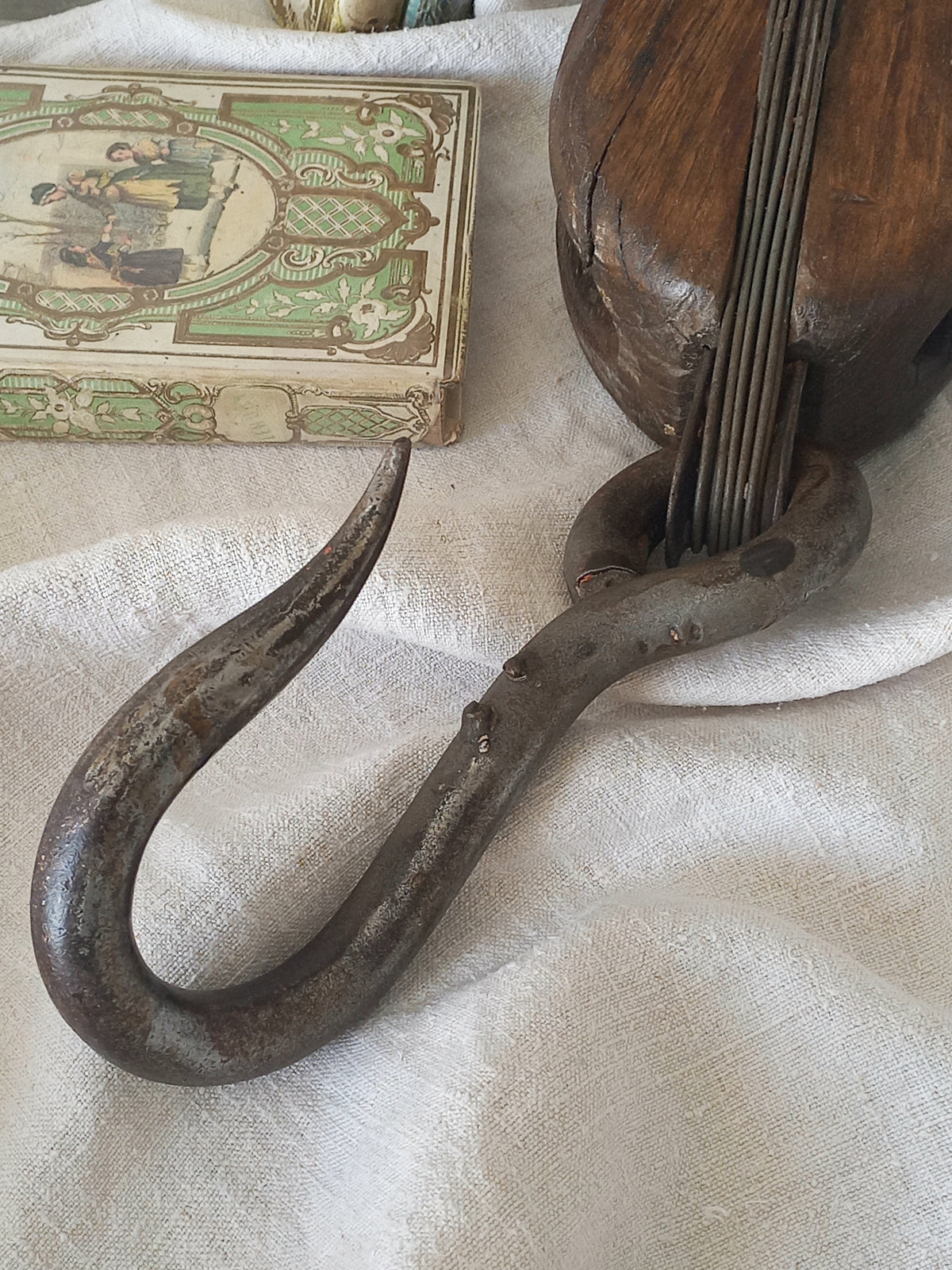 A beautiful aged antique wooden pulley block with a heavy metal hanging hook - a really fantastic piece with many decorative possibilities such a plant hanger or nautical/coastal decor.