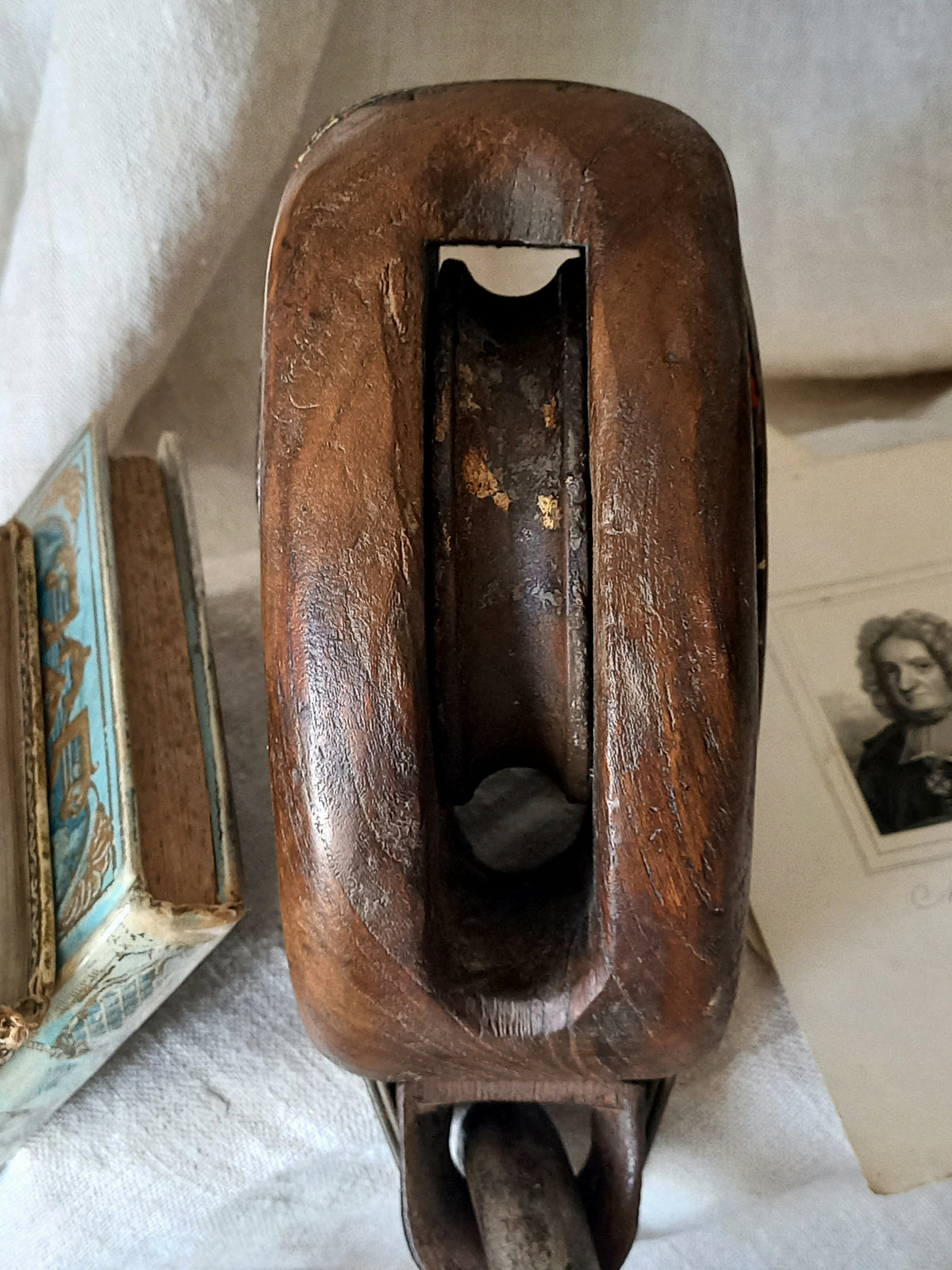 A beautiful aged antique wooden pulley block with a heavy metal hanging hook - a really fantastic piece with many decorative possibilities such a plant hanger or nautical/coastal decor.