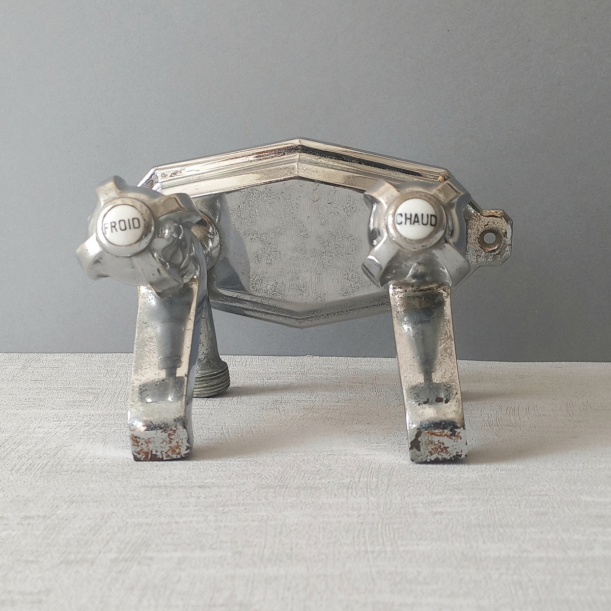 Stylish French vintage hot and cold faucet taps that are heavy, quality pieces probably dating from the 1930s time-frame. These old taps are being sold only as a restoration piece or project.