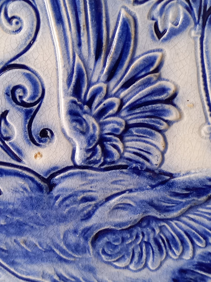 Close-up view of antique decorative majolica plate by premier Belgian manufacture, Wasmuel.