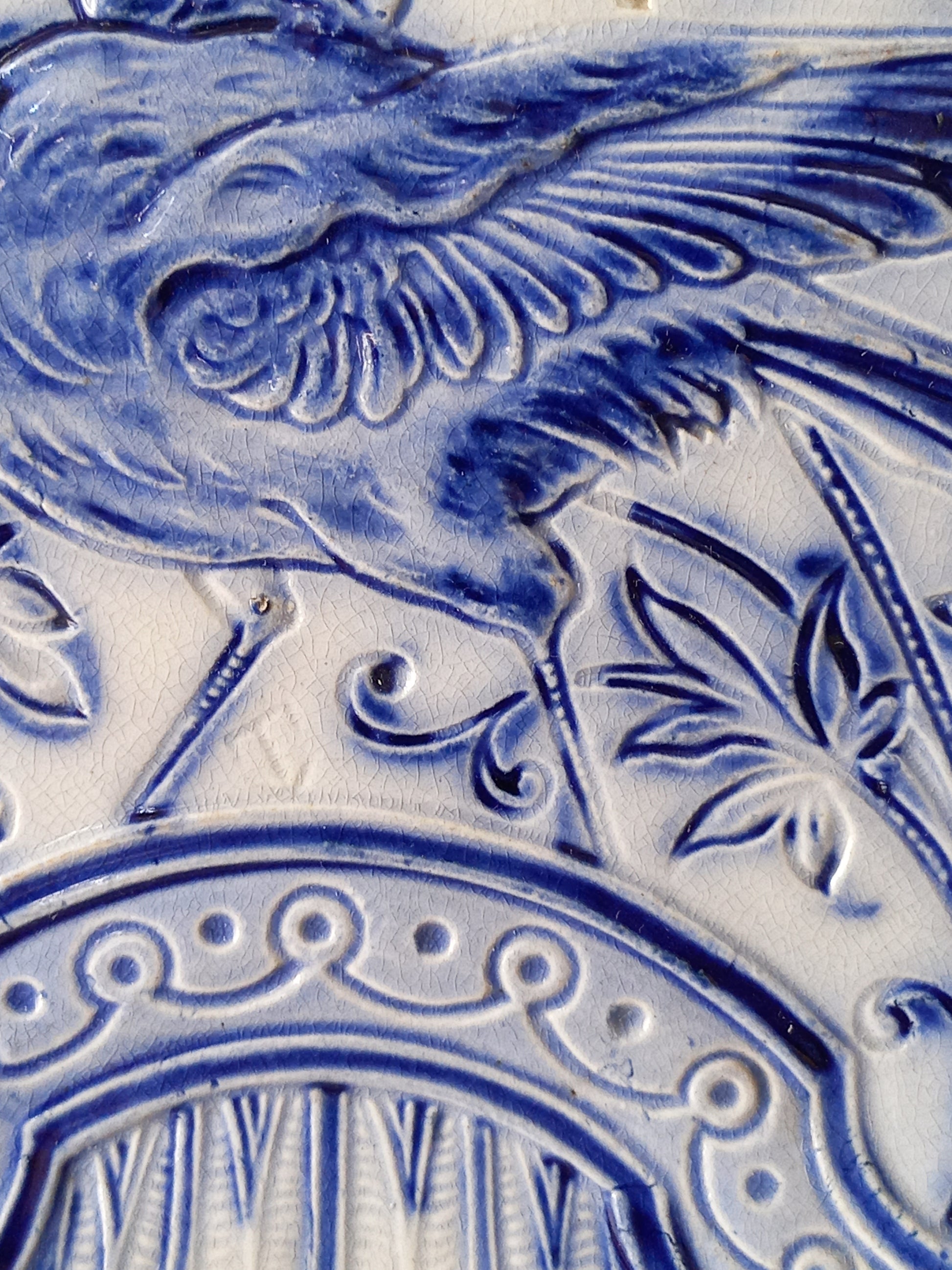 close-up of antique decorative majolica plate by premier Belgian manufacture, Wasmuel.