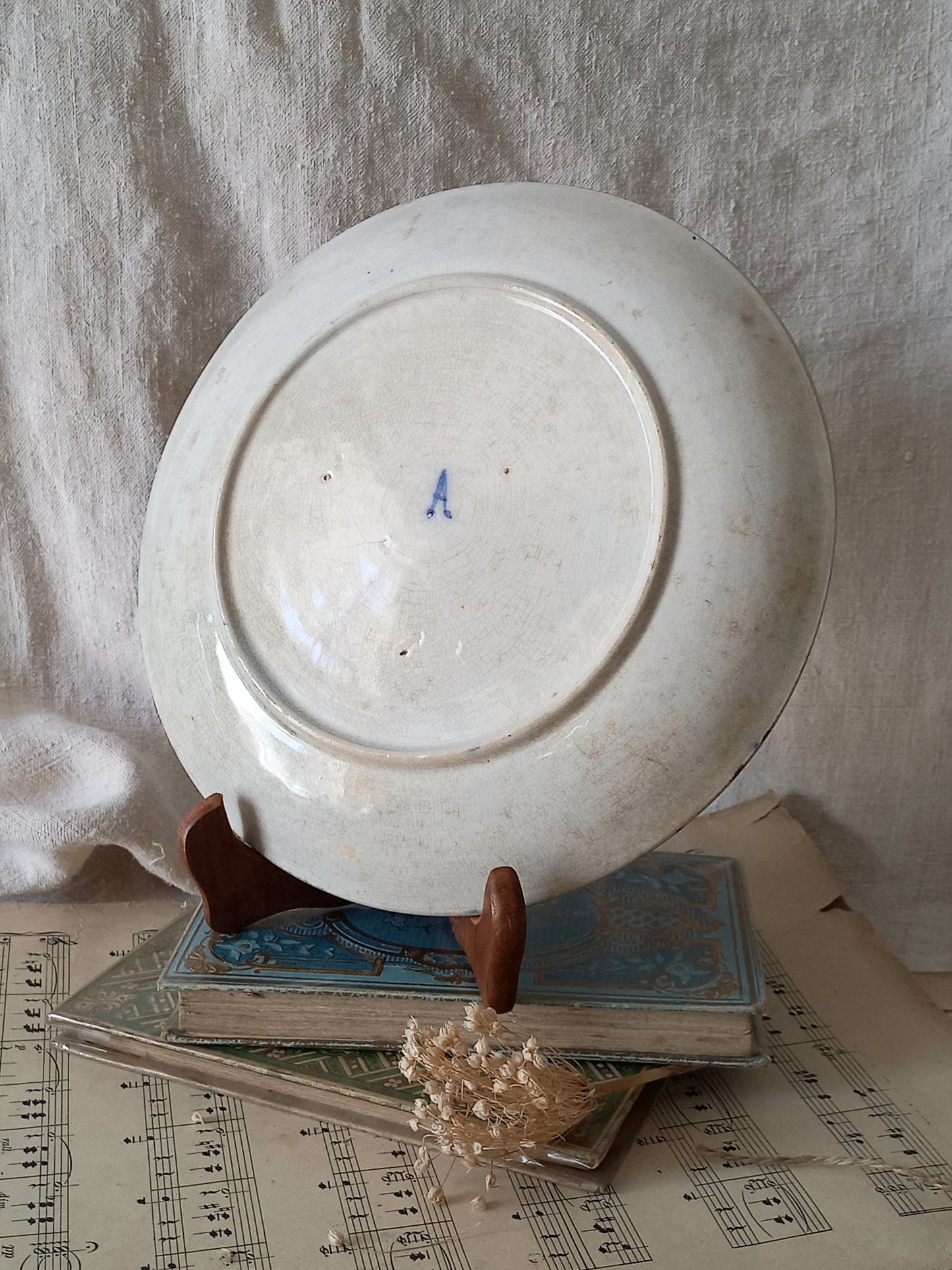 Rear view of antique decorative majolica plate by premier Belgian manufacture, Wasmuel.