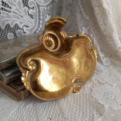 Decorative vintage brass inkwell with white porcelain ink cup