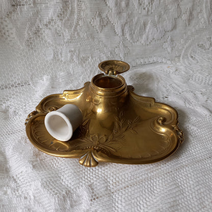 Decorative vintage brass inkwell with white porcelain ink cup