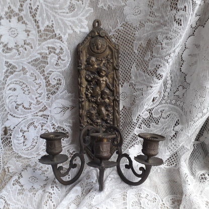 Antique wall mounted bronze candle holder with cherubs, French antique candle sconce