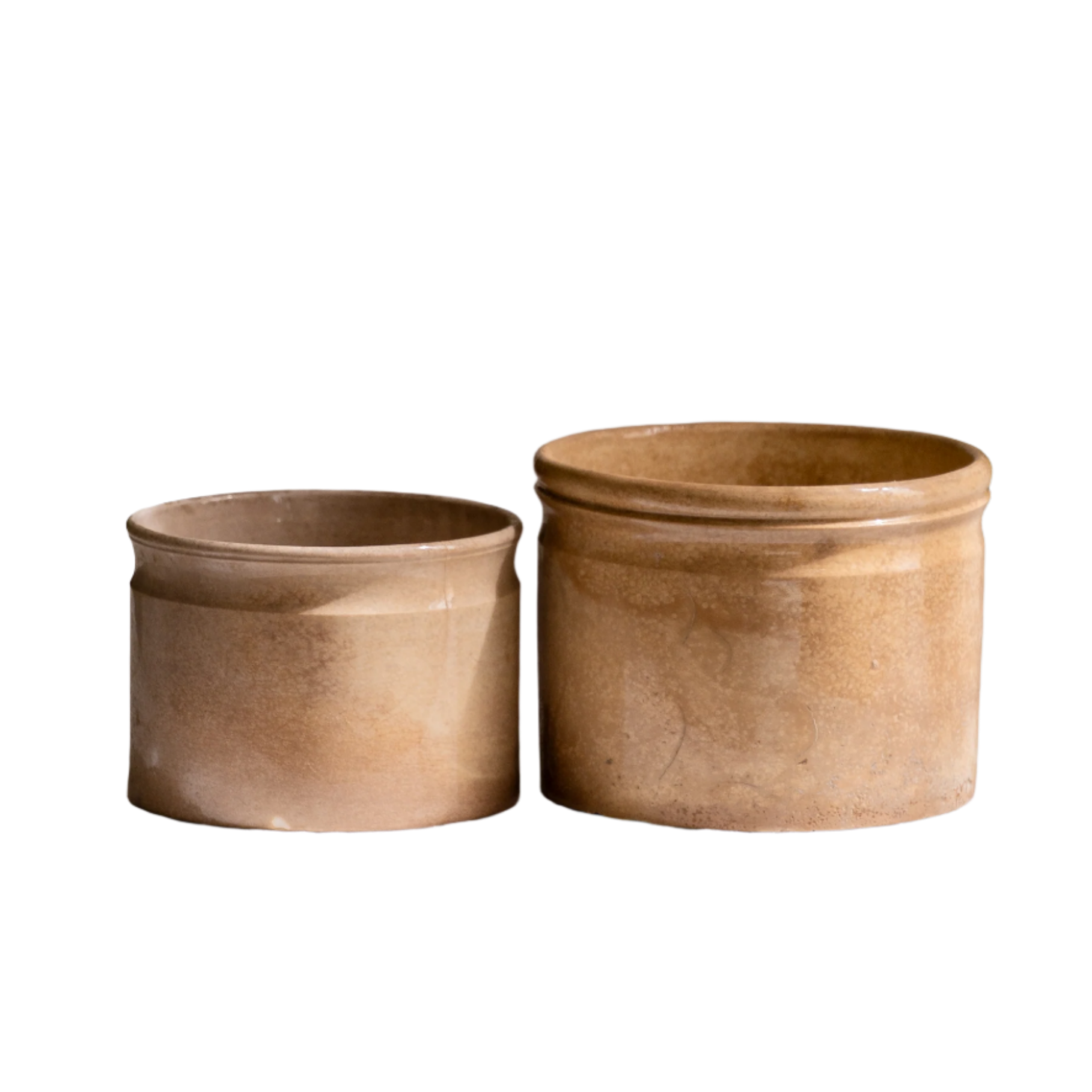 A pair of French antique tea-stained white to creamy brown ironstone crock pots or preserve pots.

In the past these small pots were quintessential pieces in French kitchens for storing jam, etc, and these days are still just as useful for items such as utensils.

Smaller pot was manufactured by Choisy le Roi, circa. late 1800s. The larger pot has no maker's mark - circa. late 1800s/early 1900s.