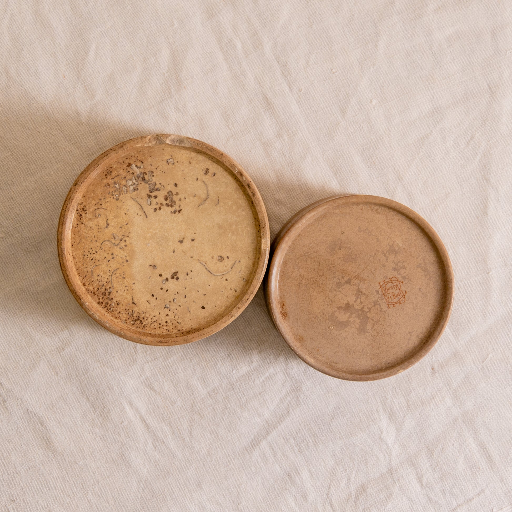 A pair of French antique tea-stained white to creamy brown ironstone crock pots or preserve pots.

In the past these small pots were quintessential pieces in French kitchens for storing jam, etc, and these days are still just as useful for items such as utensils.

Smaller pot was manufactured by Choisy le Roi, circa. late 1800s. The larger pot has no maker's mark - circa. late 1800s/early 1900s.