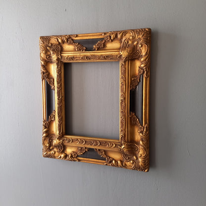 Stunning vintage frame for a painting or photo with ornate decoration in an antique style from France. This frame is a solid and heavy piece, seems to be wooden although we also think there might be some plaster so we are calling it a frame made of mixed materials.