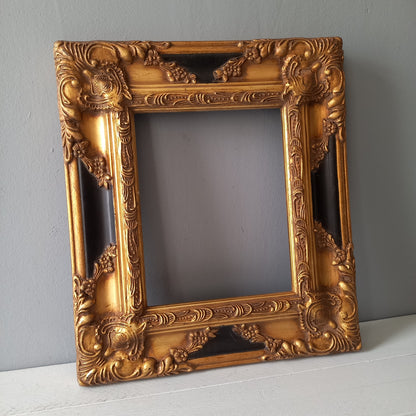 Stunning vintage frame for a painting or photo with ornate decoration in an antique style from France. This frame is a solid and heavy piece, seems to be wooden although we also think there might be some plaster so we are calling it a frame made of mixed materials.