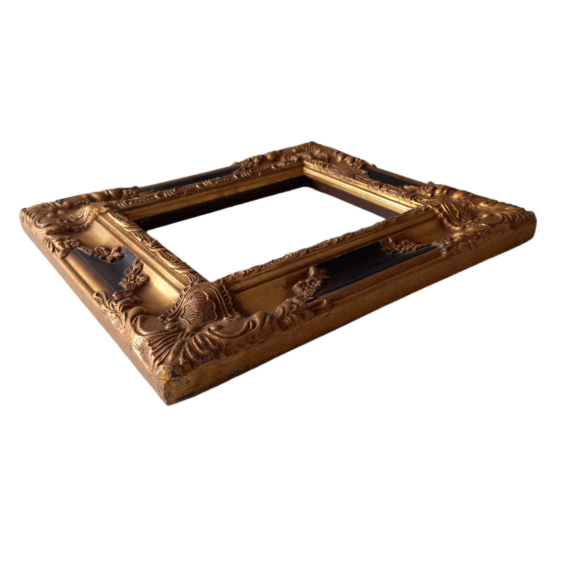 Stunning vintage frame for a painting or photo with ornate decoration in an antique style from France. This frame is a solid and heavy piece, seems to be wooden although we also think there might be some plaster so we are calling it a frame made of mixed materials.