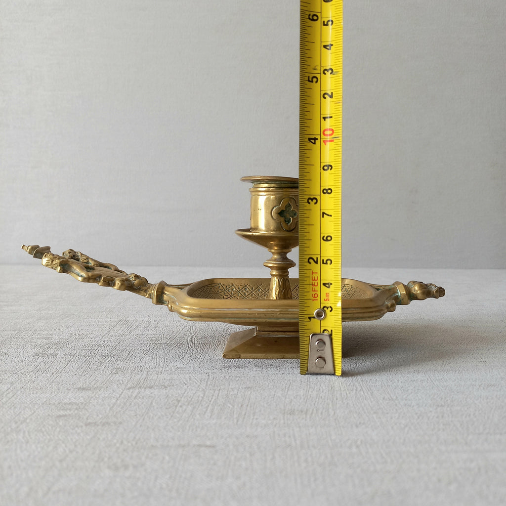 A French antique bronze/brass candle holder or chamber stick, a quality piece that is highly detailed with engraved patterns and a coat of arms with two lovely lions on the handle! This is a heavy piece for its small size and will make super home decor in any interior.