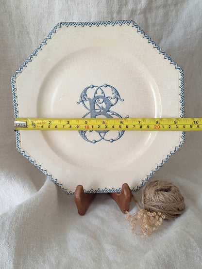 French antique ironstone octagonal plate with the monogram/initial 'B' and a tape measure for reference.
