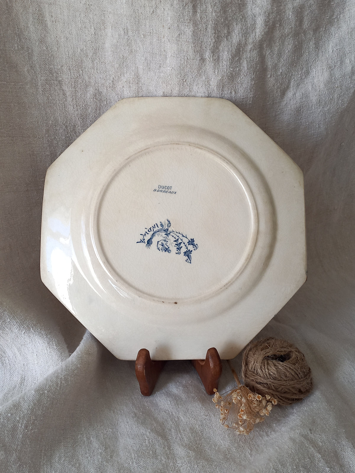 Rear of a French antique ironstone octagonal plate with the monogram/initial 'B'.
