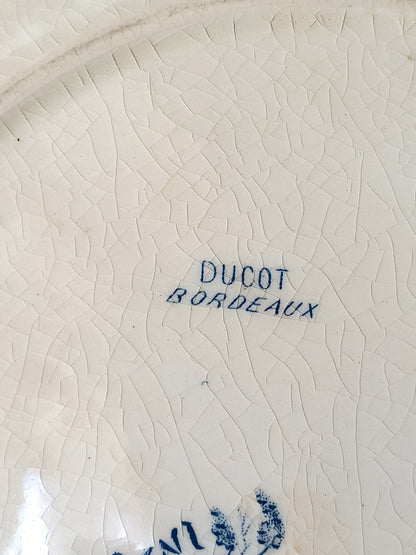 Rear of a French antique ironstone octagonal plate with the monogram/initial 'B'.
