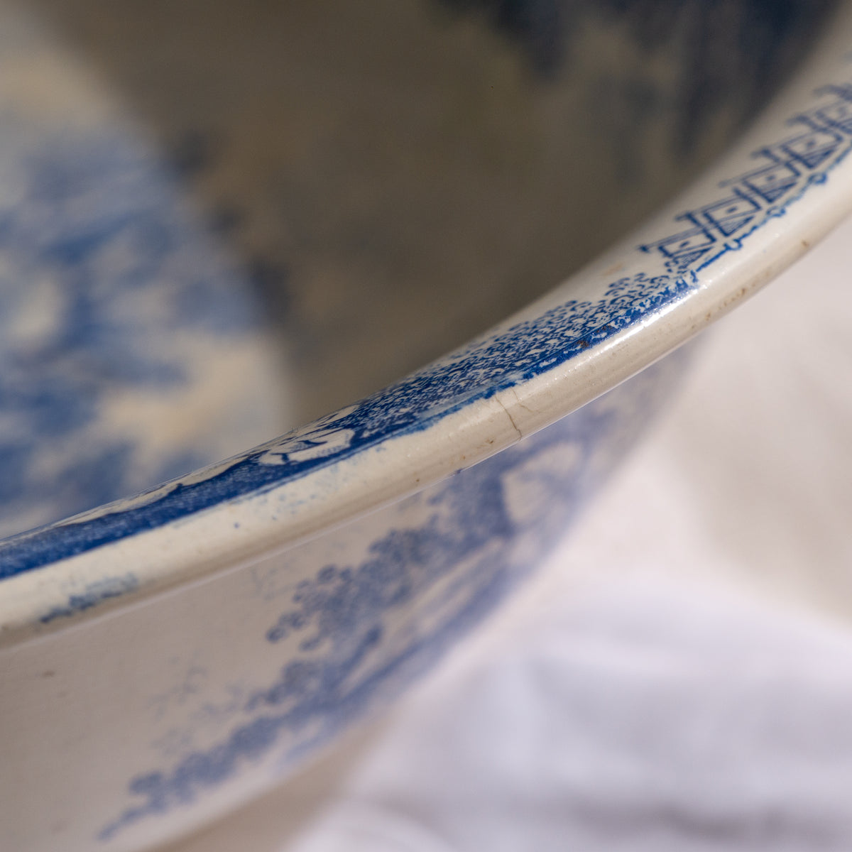 A large and beautiful antique white ironstone bowl or wash basin with blue floral pattern by premier French manufacturer, Sarreguemines.
This piece is circa. 1875 - 1900 so well over 100 years old! 
A stunning piece of original antique ironstone from France that will make excellent home decor.