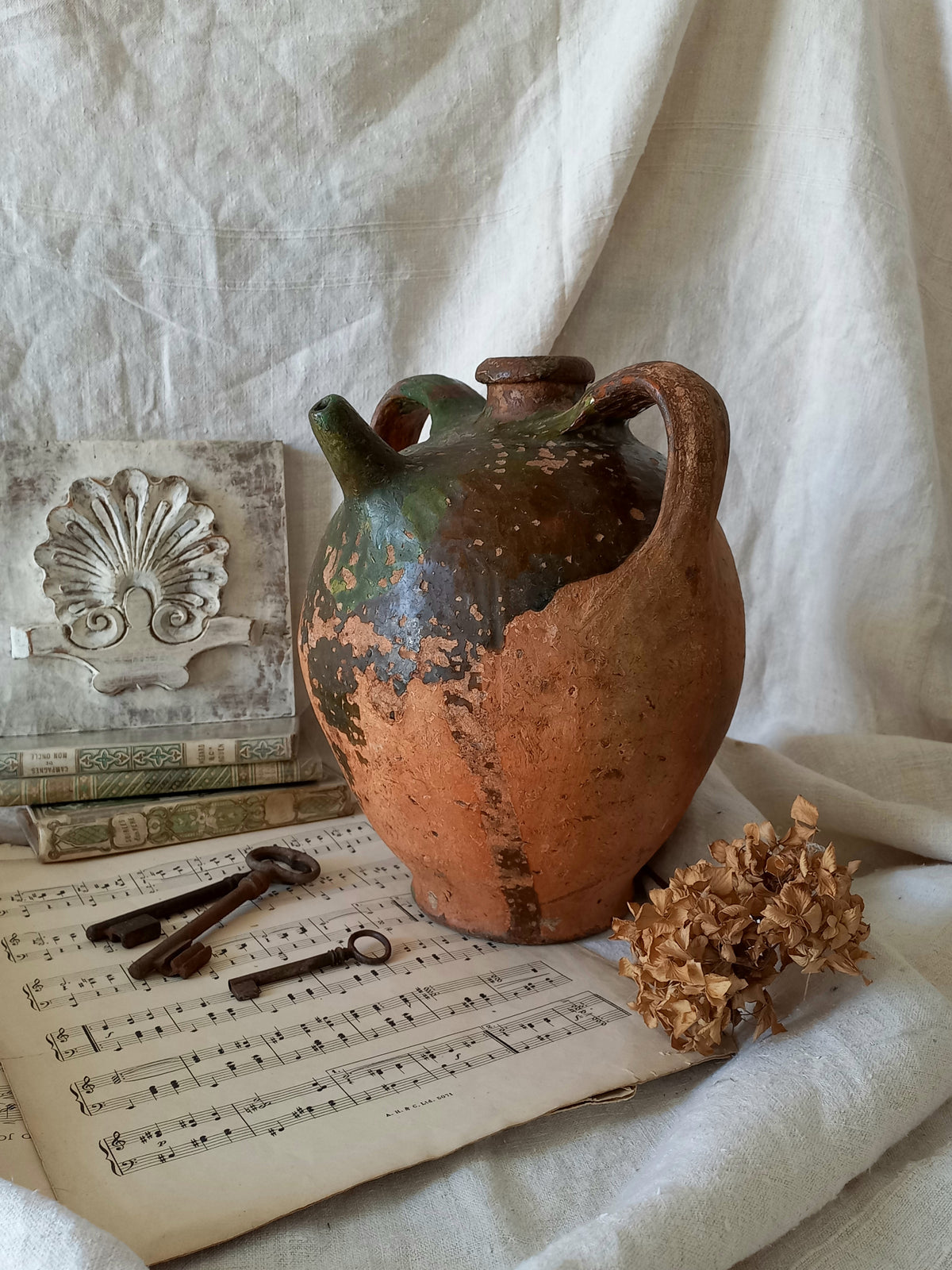 A stunning French antique stoneware terracotta oil preserving jar.