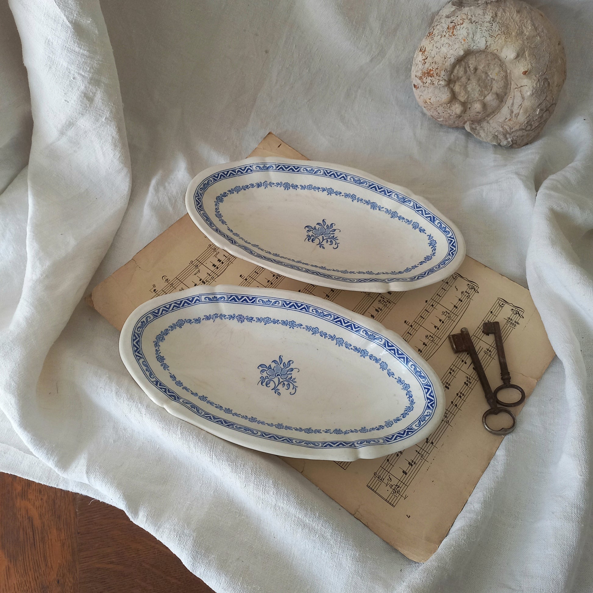 A beautiful pair of French vintage white ironstone side plates or raviers with attractive blue designs. These particular pieces were manufactured by Gien.