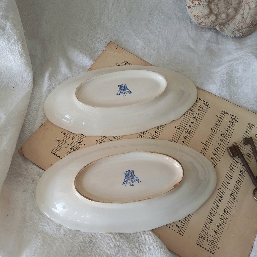 A beautiful pair of French vintage white ironstone side plates or raviers with attractive blue designs. These particular pieces were manufactured by Gien.