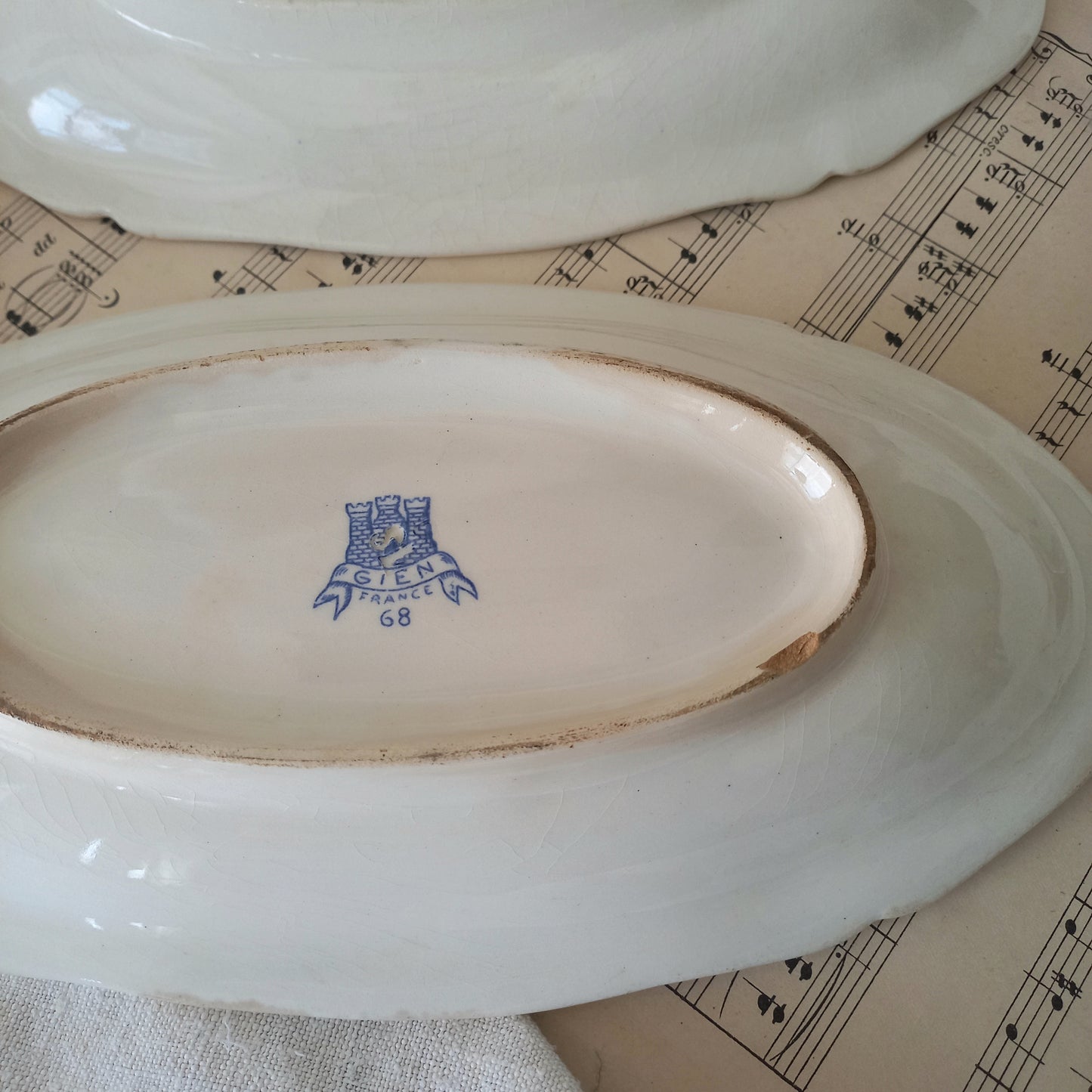 A beautiful pair of French vintage white ironstone side plates or raviers with attractive blue designs. These particular pieces were manufactured by Gien.