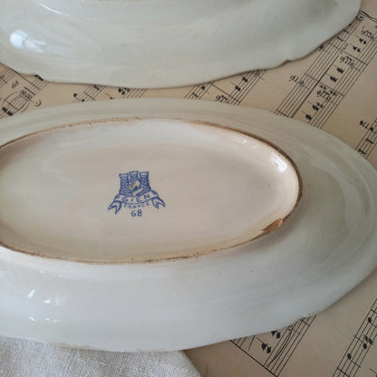 A beautiful pair of French vintage white ironstone side plates or raviers with attractive blue designs. These particular pieces were manufactured by Gien.