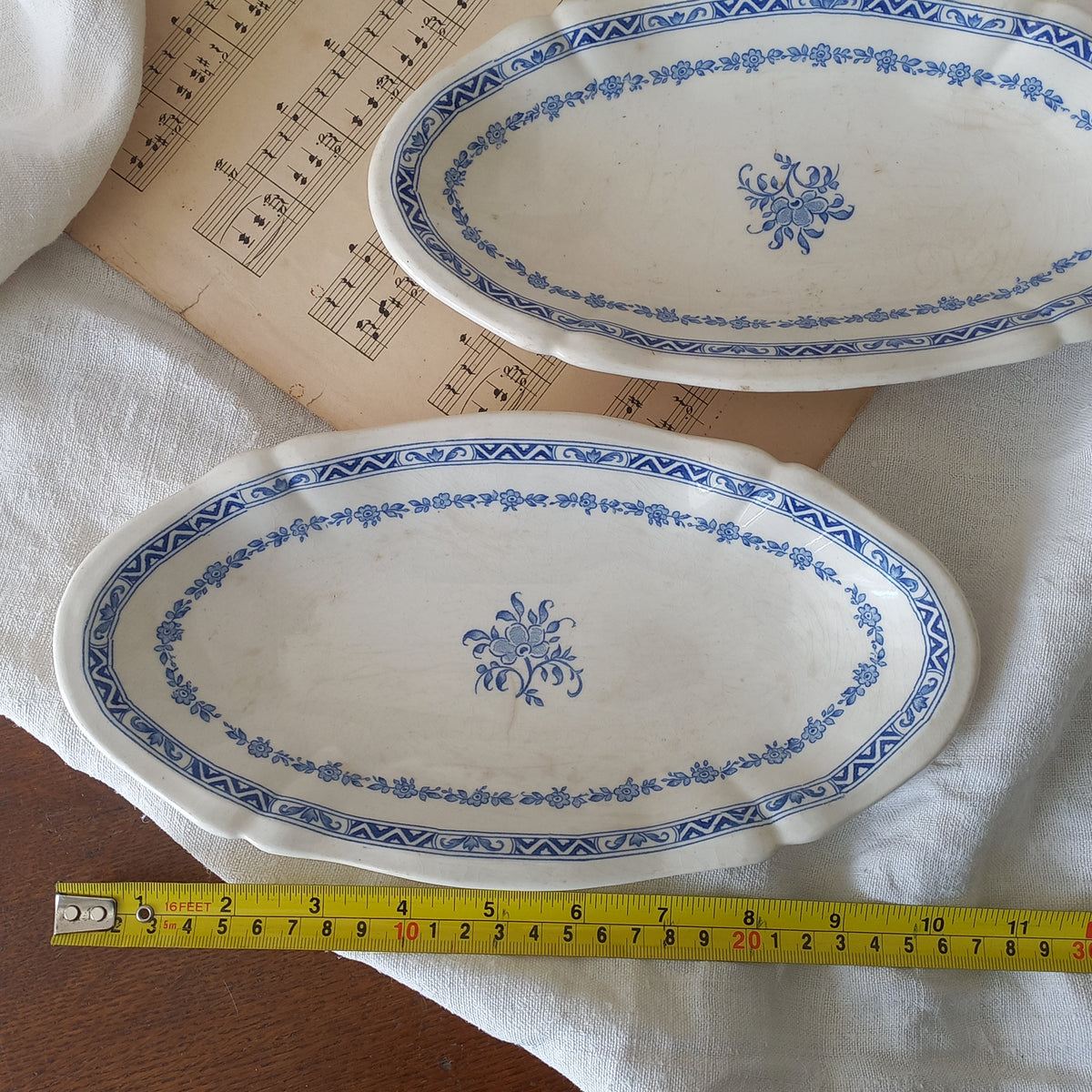 A beautiful pair of French vintage white ironstone side plates or raviers with attractive blue designs. These particular pieces were manufactured by Gien.
