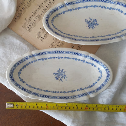 A beautiful pair of French vintage white ironstone side plates or raviers with attractive blue designs. These particular pieces were manufactured by Gien.