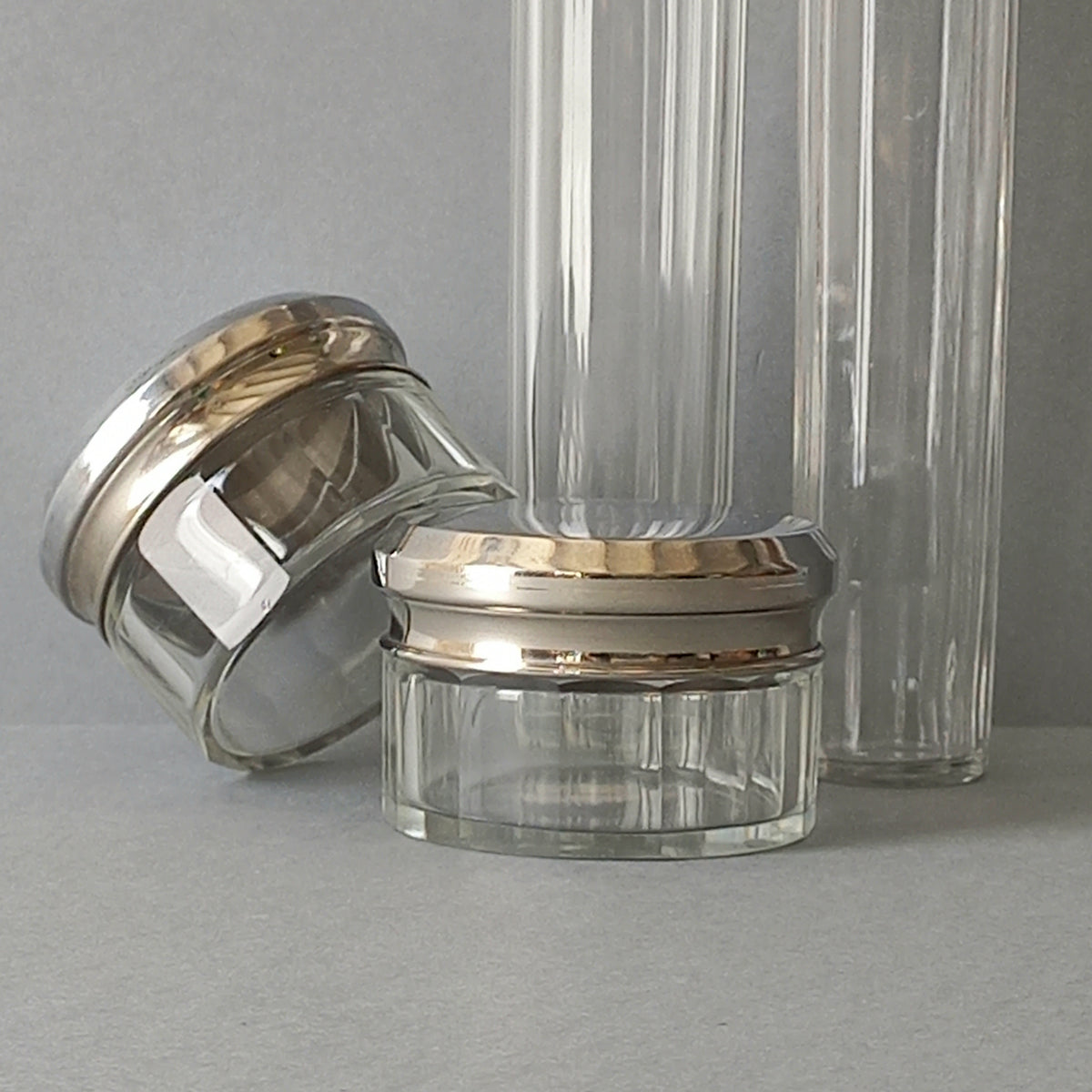 A set of 4 small French vintage decorative glass perfume/scent bottles/make-up containers that will make pleasing decorative pieces in your interior.