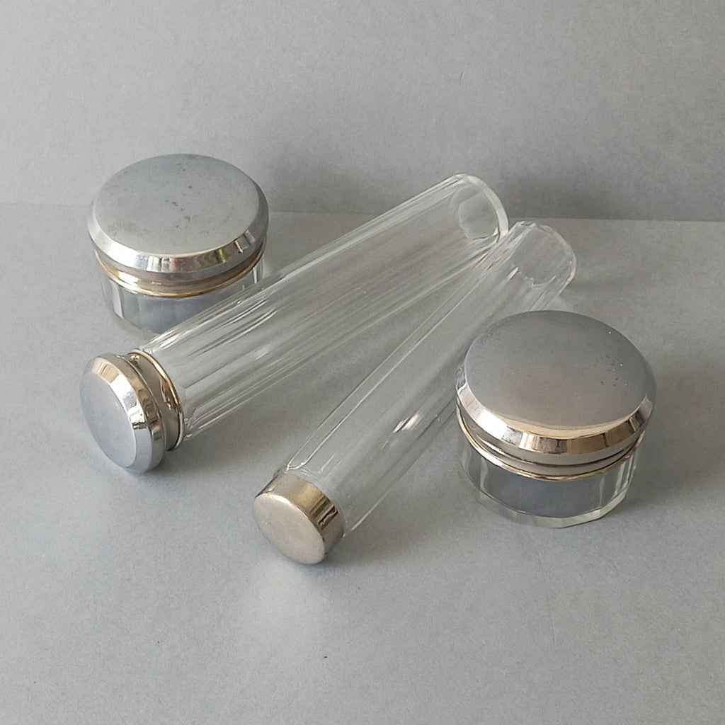 A set of 4 small French vintage decorative glass perfume/scent bottles/make-up containers that will make pleasing decorative pieces in your interior.