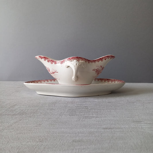 A French antique ironstone gravy boat with a pretty pink floral transfer pattern, a heavy and quality piece manufactured by St. Amand,circa. early 20th century.