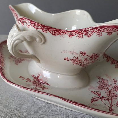 A French antique ironstone gravy boat with a pretty pink floral transfer pattern, a heavy and quality piece manufactured by St. Amand,circa. early 20th century.