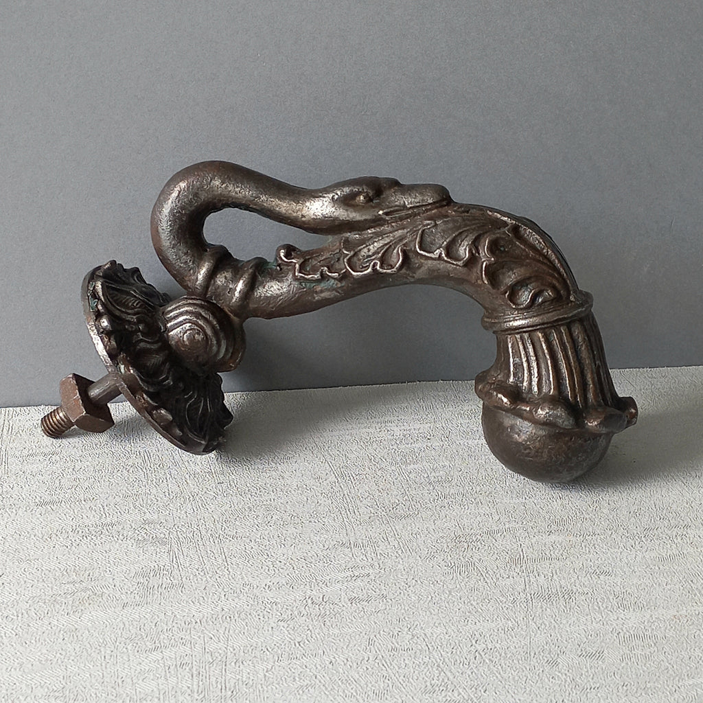 A stunning and large antique cast iron decorative door knocker with an elegant swan's neck and head, a very heavy and original antique piece purchased in south west France. 