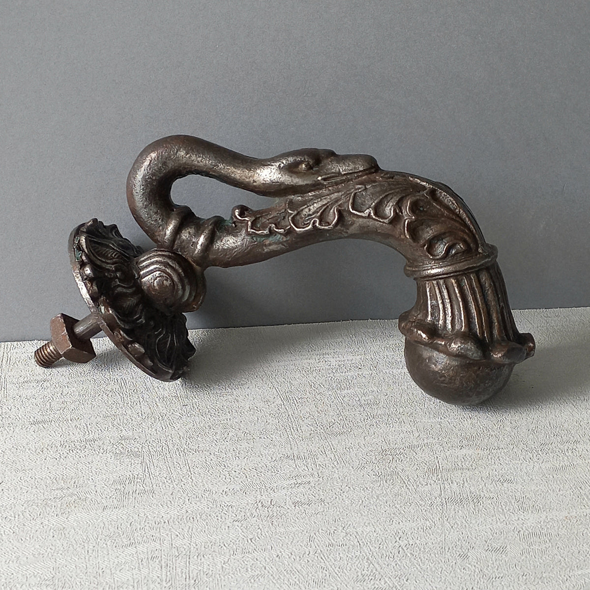 A stunning and large antique cast iron decorative door knocker with an elegant swan's neck and head, a very heavy and original antique piece purchased in south west France. 