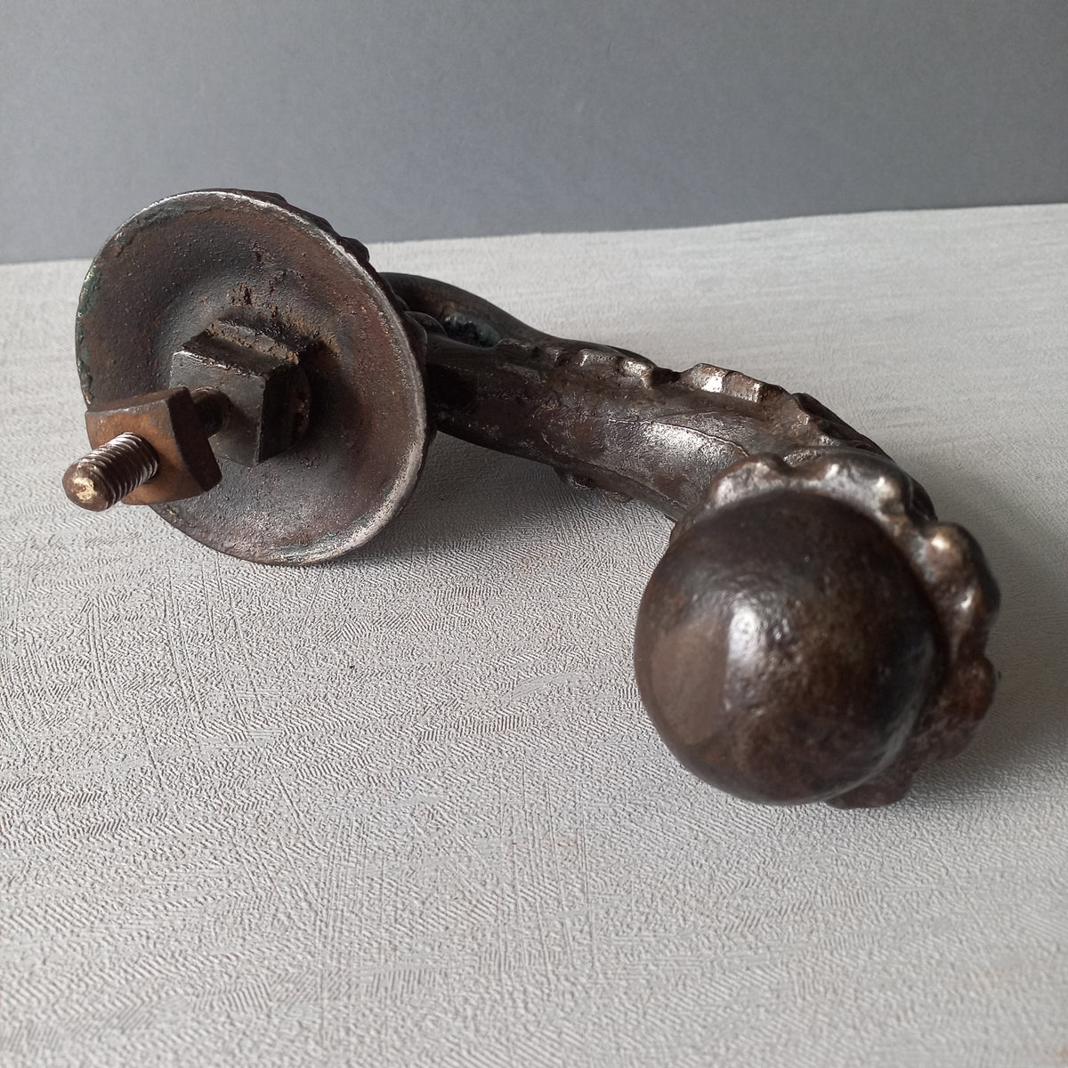 A stunning and large antique cast iron decorative door knocker with an elegant swan's neck and head, a very heavy and original antique piece purchased in south west France. 
