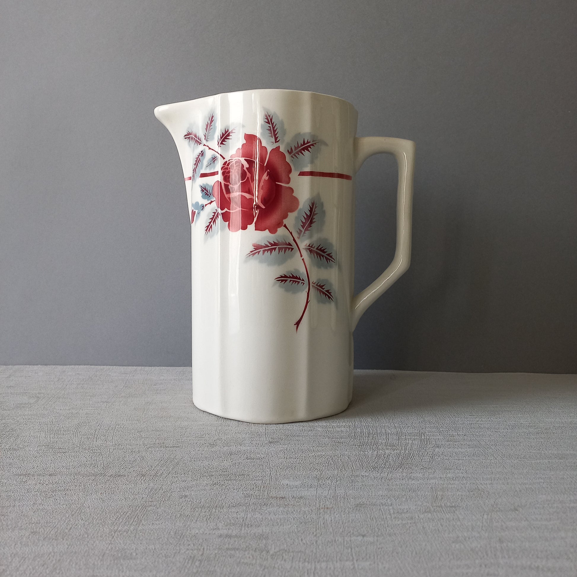 A French vintage ironstone pitcher jug with pink/red floral transfer pattern, once part of a wash-set, this beautiful and very heavy, tall jug/pitcher makes a wonderful piece of vintage decor.