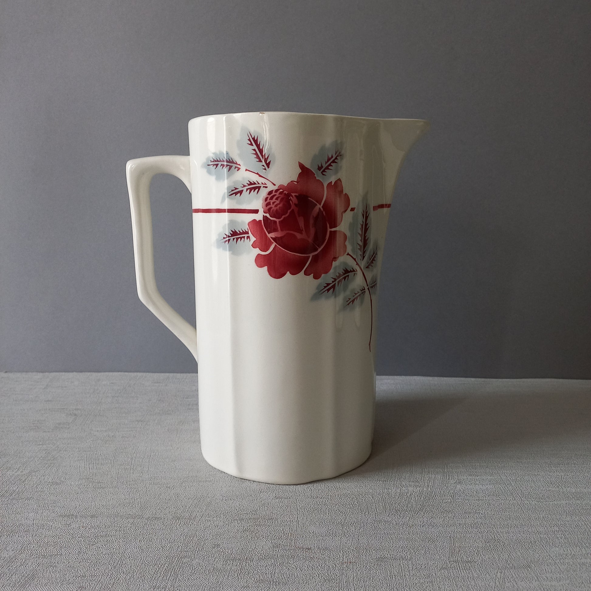 A French vintage ironstone pitcher jug with pink/red floral transfer pattern, once part of a wash-set, this beautiful and very heavy, tall jug/pitcher makes a wonderful piece of vintage decor.