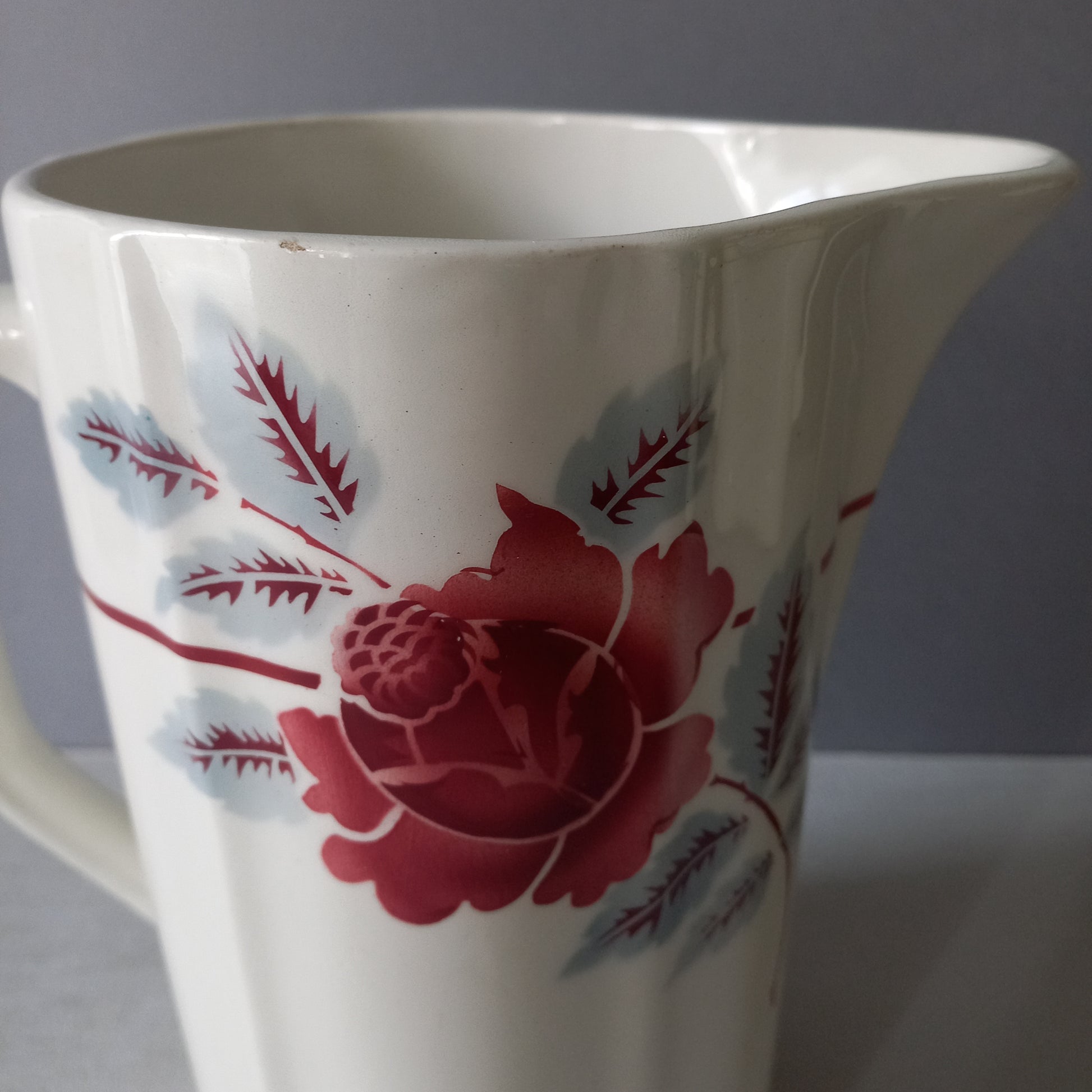 A French vintage ironstone pitcher jug with pink/red floral transfer pattern, once part of a wash-set, this beautiful and very heavy, tall jug/pitcher makes a wonderful piece of vintage decor.