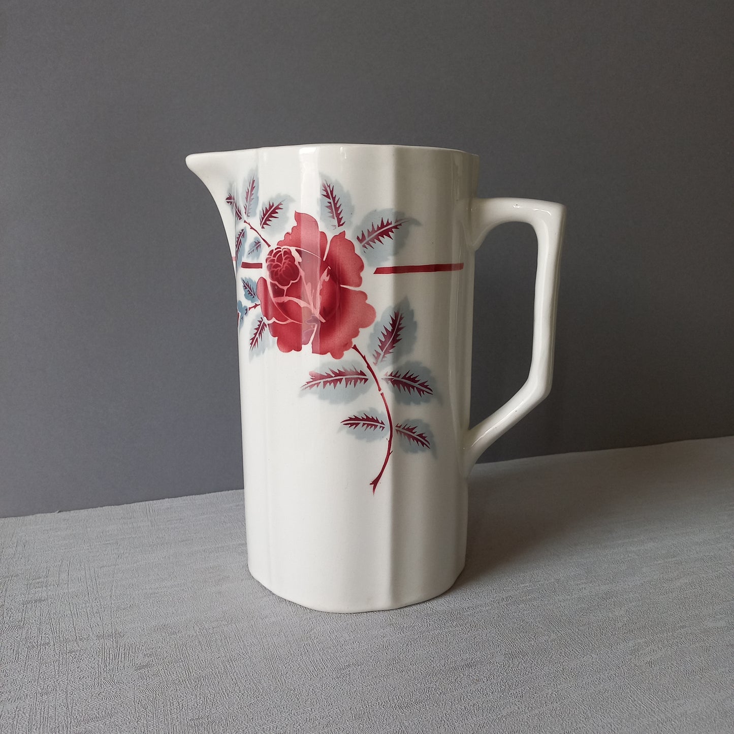 A French vintage ironstone pitcher jug with pink/red floral transfer pattern, once part of a wash-set, this beautiful and very heavy, tall jug/pitcher makes a wonderful piece of vintage decor.