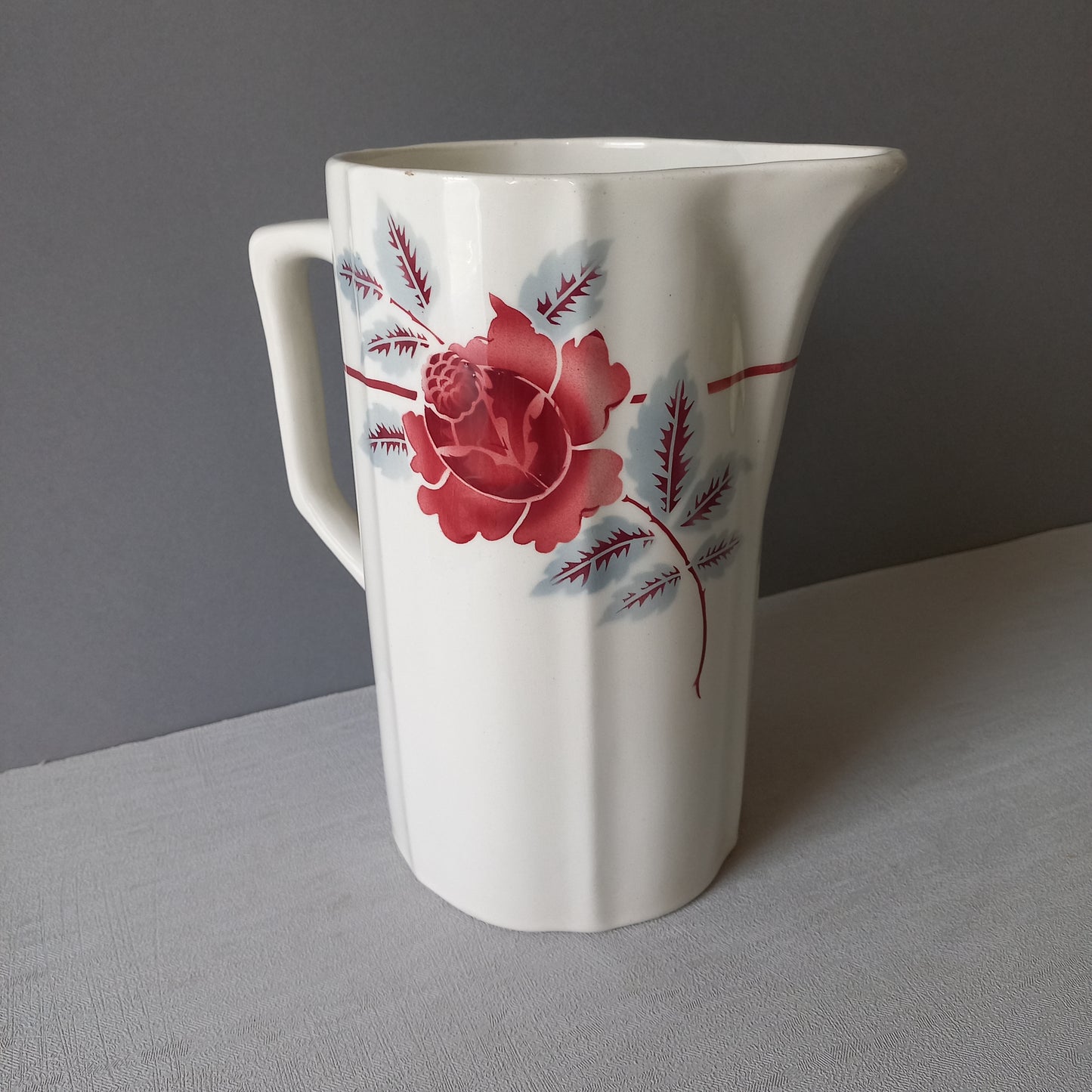 A French vintage ironstone pitcher jug with pink/red floral transfer pattern, once part of a wash-set, this beautiful and very heavy, tall jug/pitcher makes a wonderful piece of vintage decor.