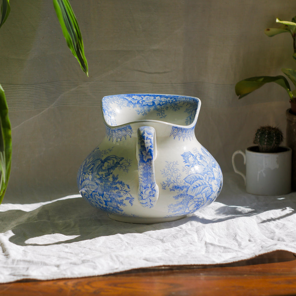 A beautiful French antique white ironstone jug with a pretty floral blue pattern. Once used as wash jugs these days these lovely old jugs make super pieces of home decor. The maker's mark is clearly identified underneath. A wonderful piece of antique ironstone!

Circa: late 1800s/early 1900s.