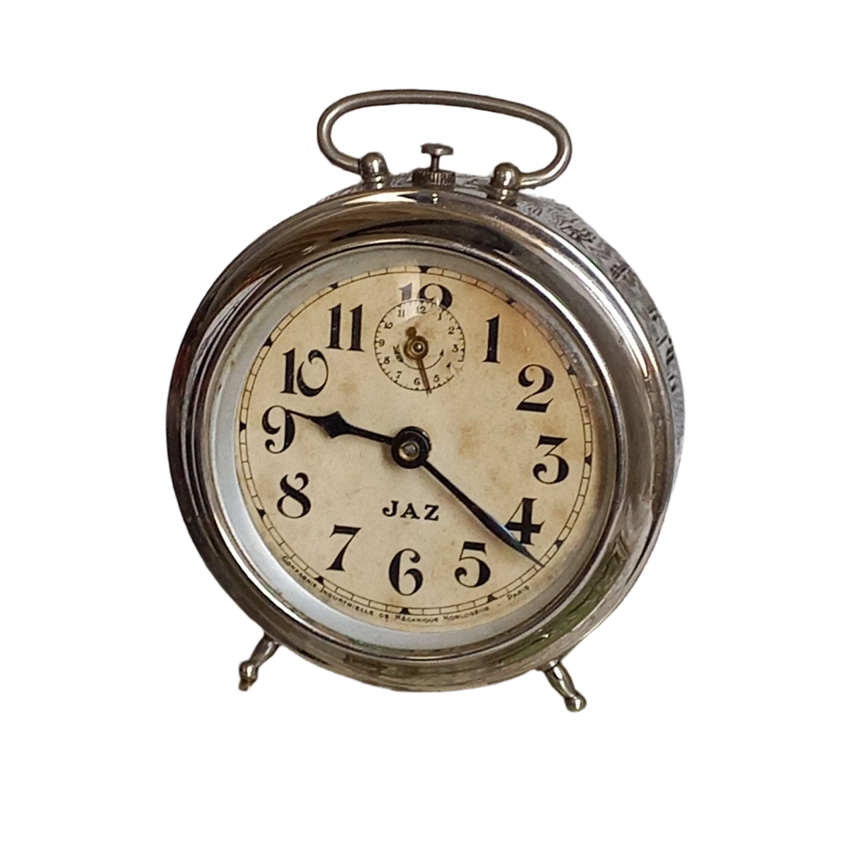 Petit réveil mécanique vintage de la société française Jaz avec boîtier chromé de couleur argent