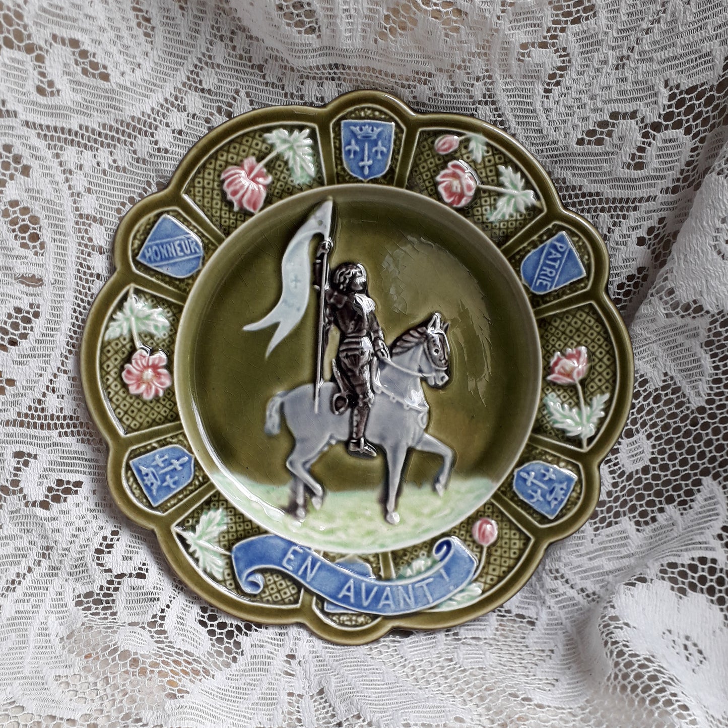 Small French antique majolica Joan of Arc wall plate, green Jeanne D'Arc wall plate