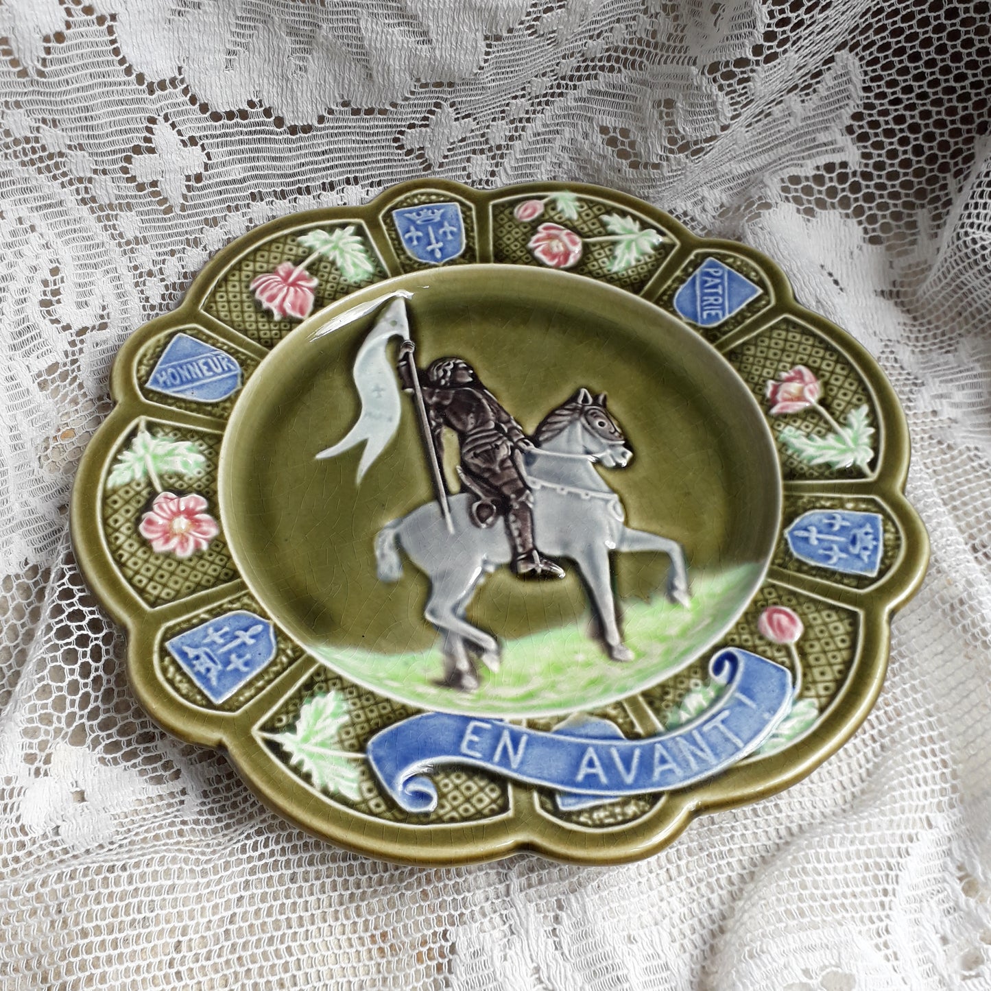 Small French antique majolica Joan of Arc wall plate, green Jeanne D'Arc wall plate