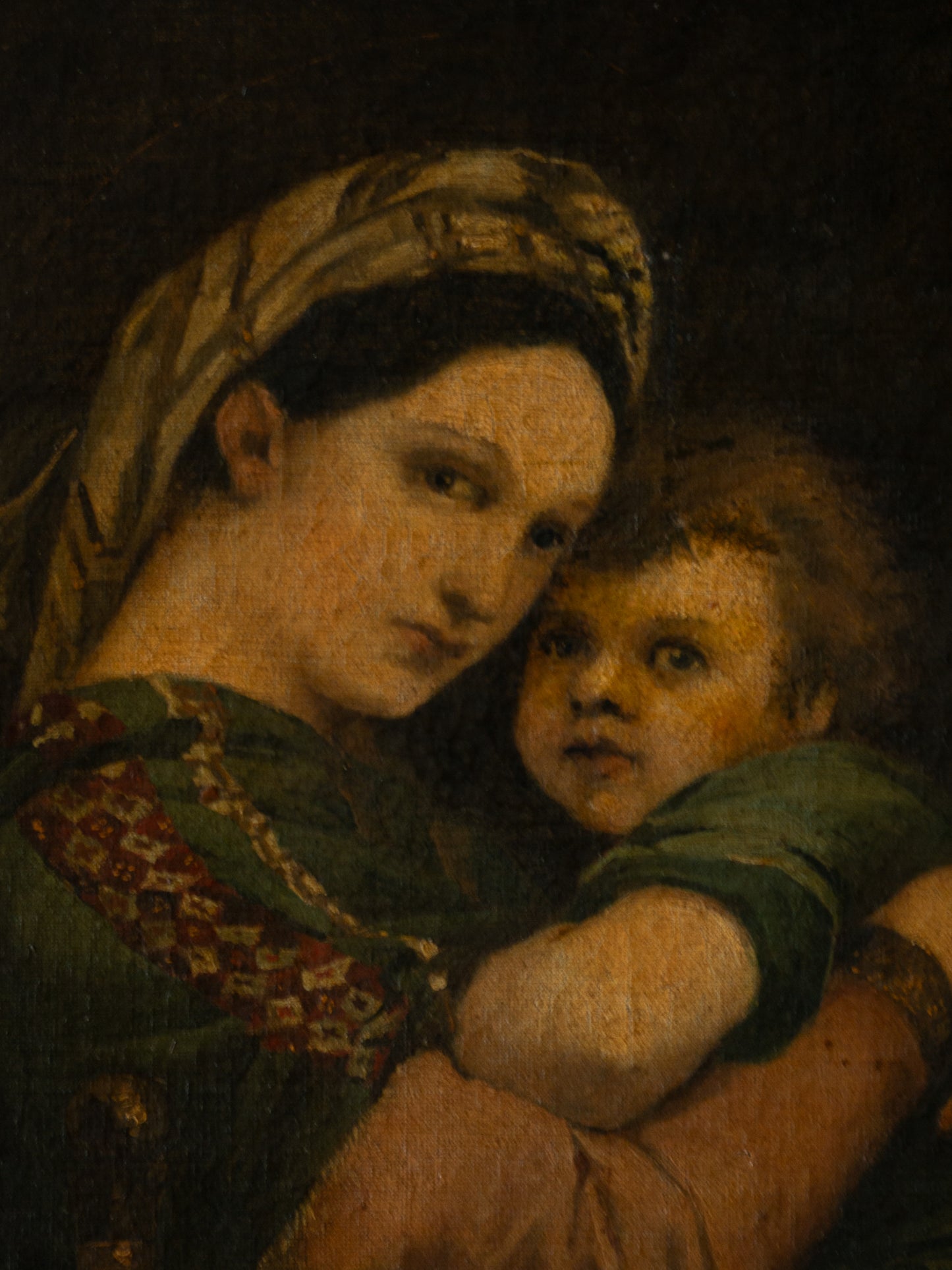 A late 19th-century/early 20th century after Raphael oil painting based on Madonna della Sedia (1513–1514, Pitti Palace, Florence). The artist (perhaps a student of the time) adapts Raphael’s tondo into a rectangular canvas, preserving the iconic green dress with patterned sleeve, the tender embrace, and the young St. John at right against a deep ground.