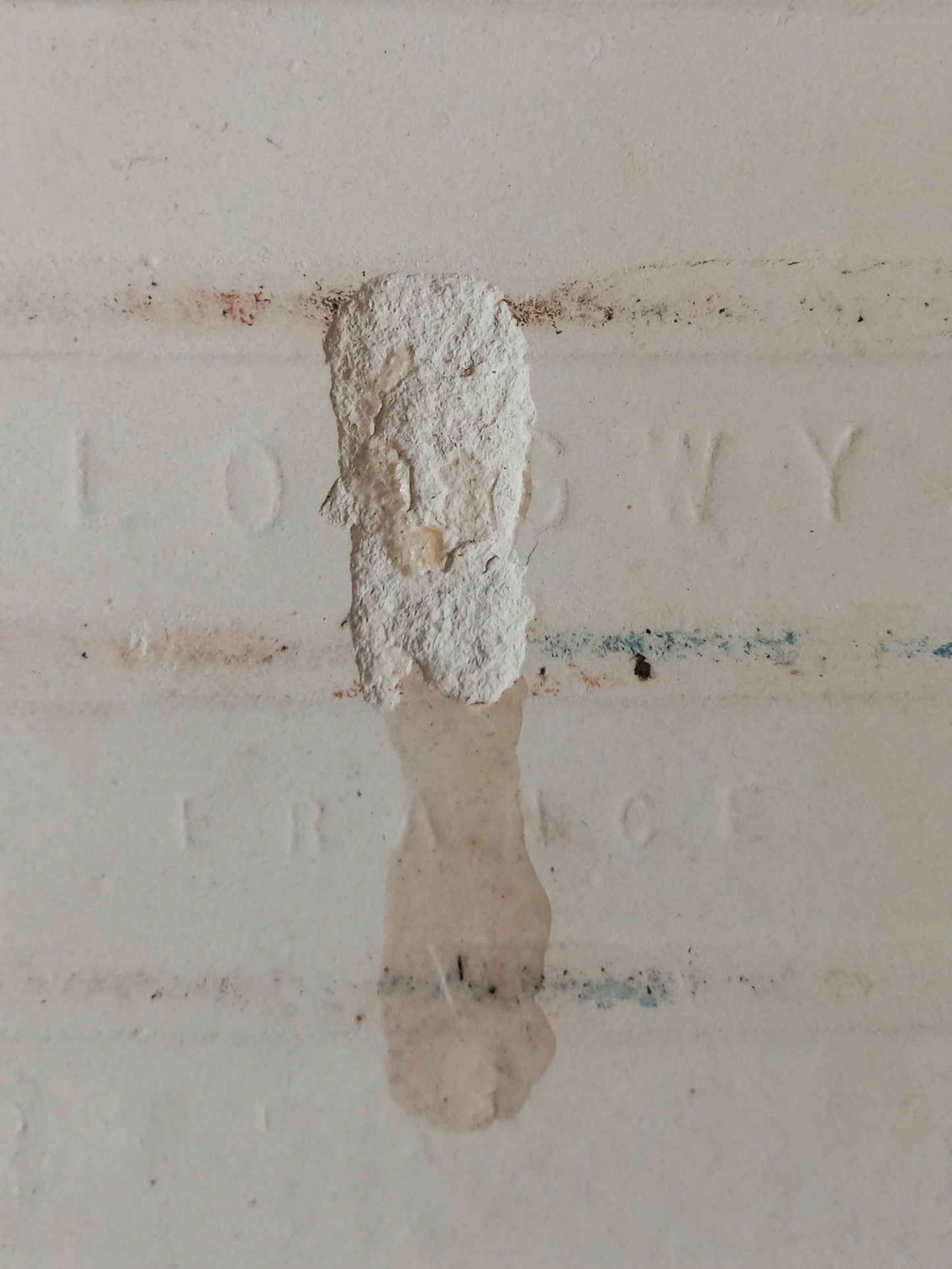 Rear of antique ceramic tile with maker's mark
